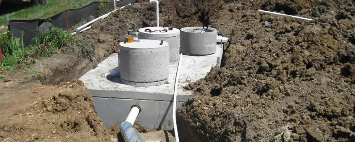 Septic system repair and installation site with tank access ports in San Antonio, TX